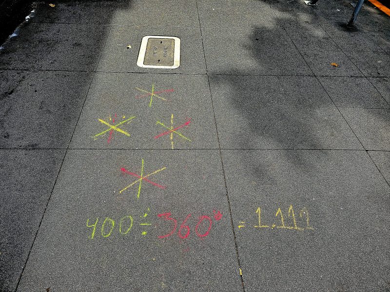 A sidewalk with a tic-tac-toe board drawn on it.