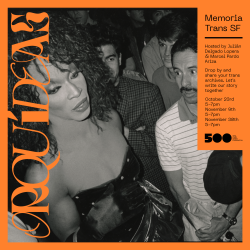 A black and white photo of a woman standing in front of a crowd.