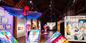 An art gallery with colorful art on display.