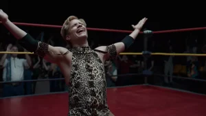 A man in a leopard print outfit in a wrestling ring.