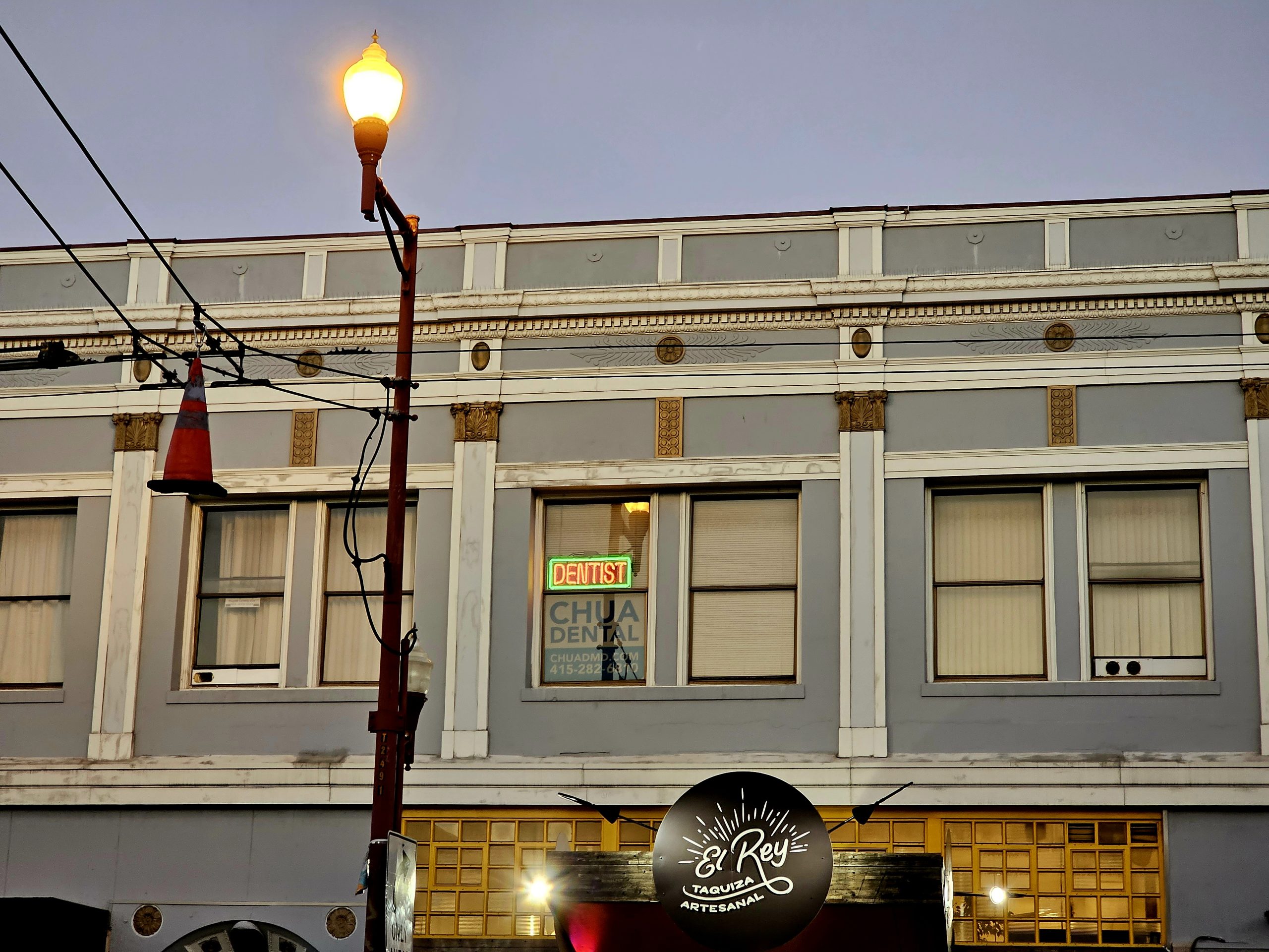 A building with a street light on it.