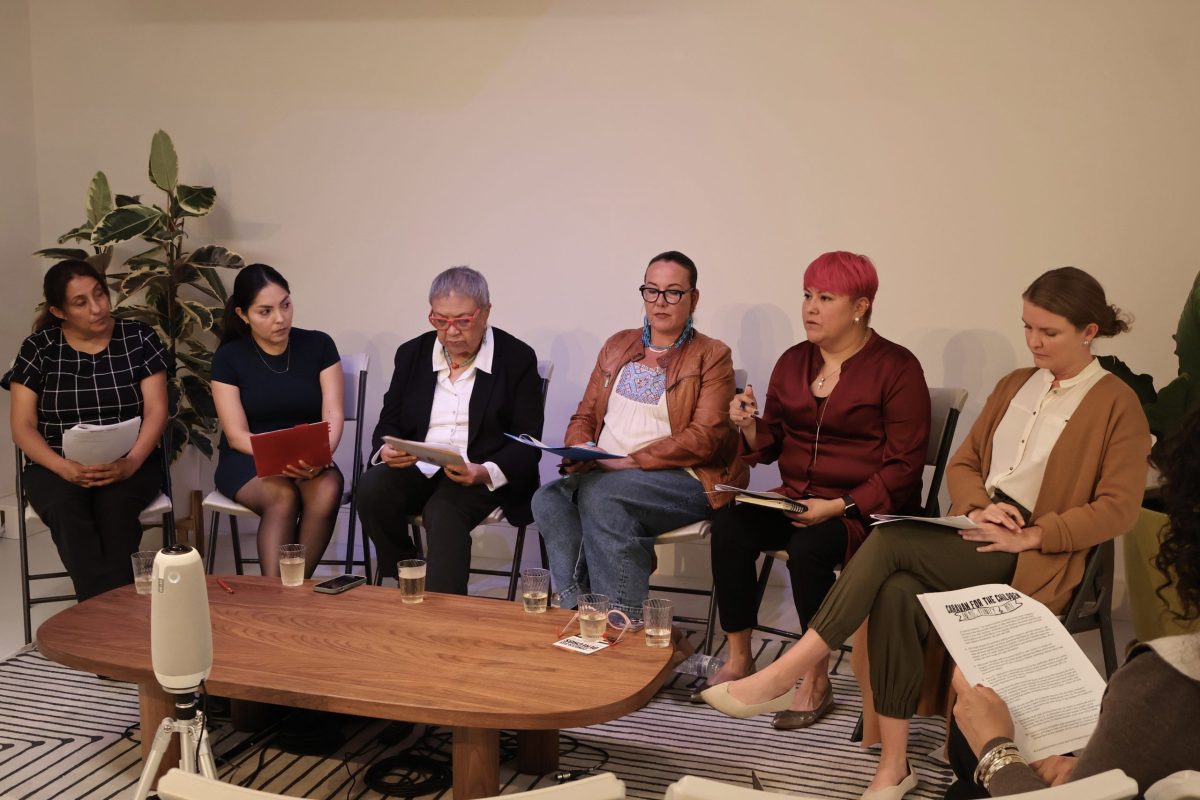 Six women sitting around a table.