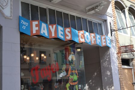A building with a sign that says Fayes coffee.