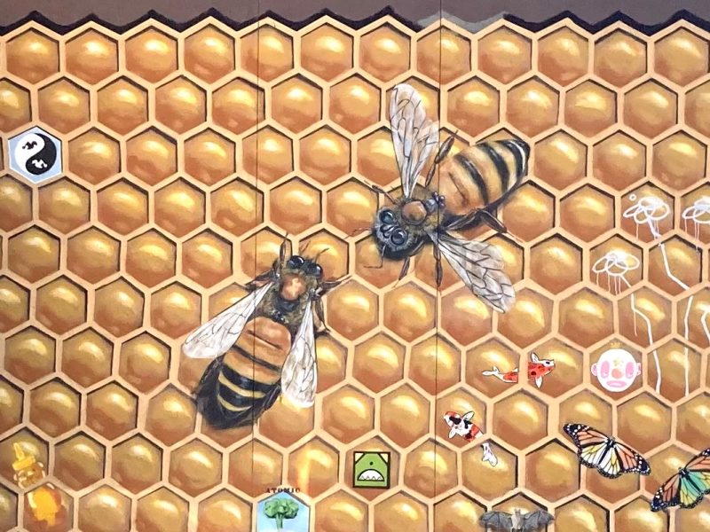 A mural of bees on a honeycomb