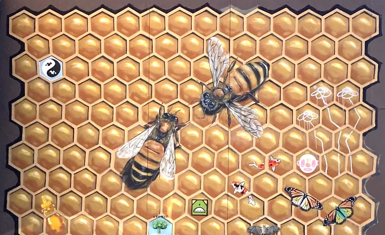 A mural of bees on a honeycomb