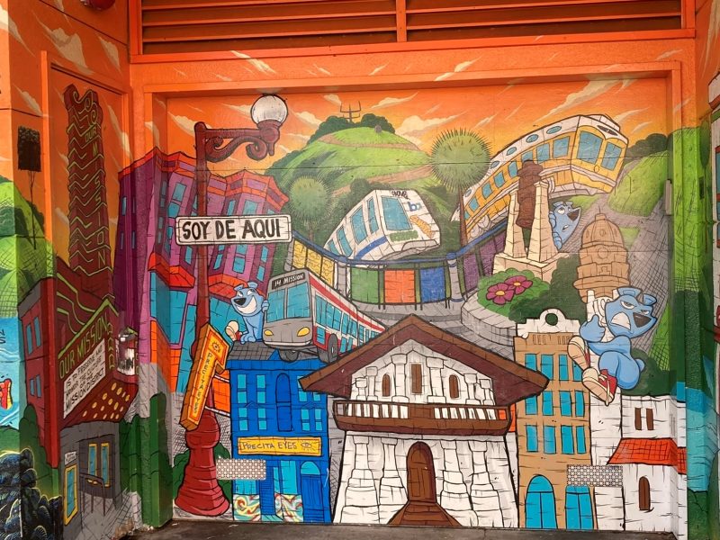 A colorful mural painted on the door of a building.