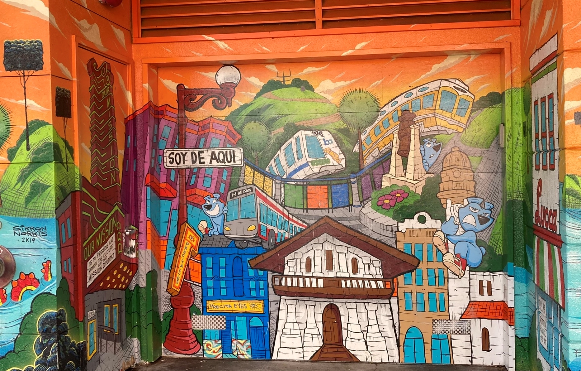 A colorful mural painted on the door of a building.