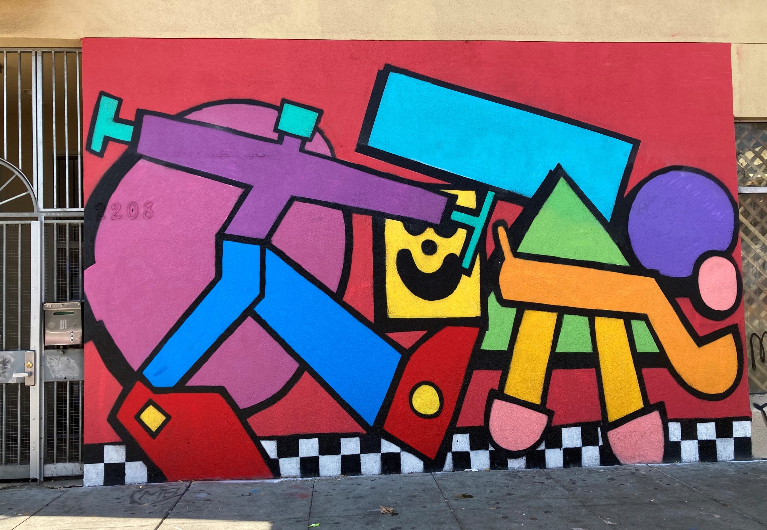Colorful wall art of a person walking a dog.