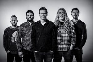 A black and white photo of a group of men.