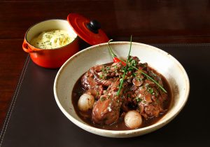 A bowl of food on a table.