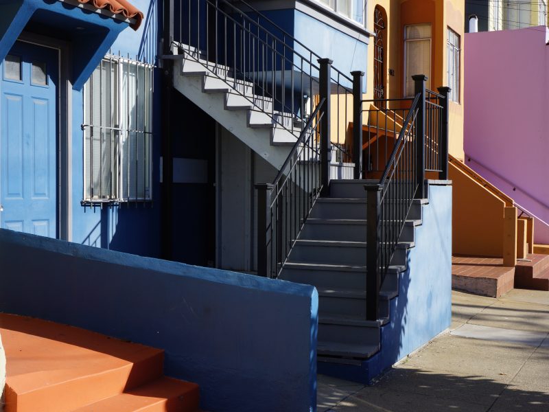 A row of colorful houses on a street in san francisco, california.