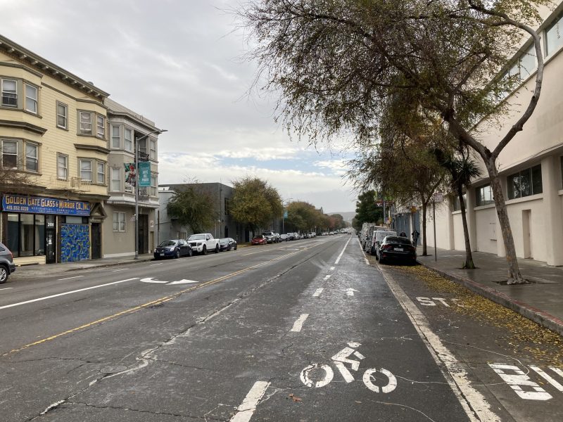 An empty street with a bike lane.