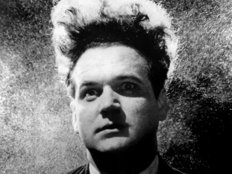 A black and white photo of a man in a suit.