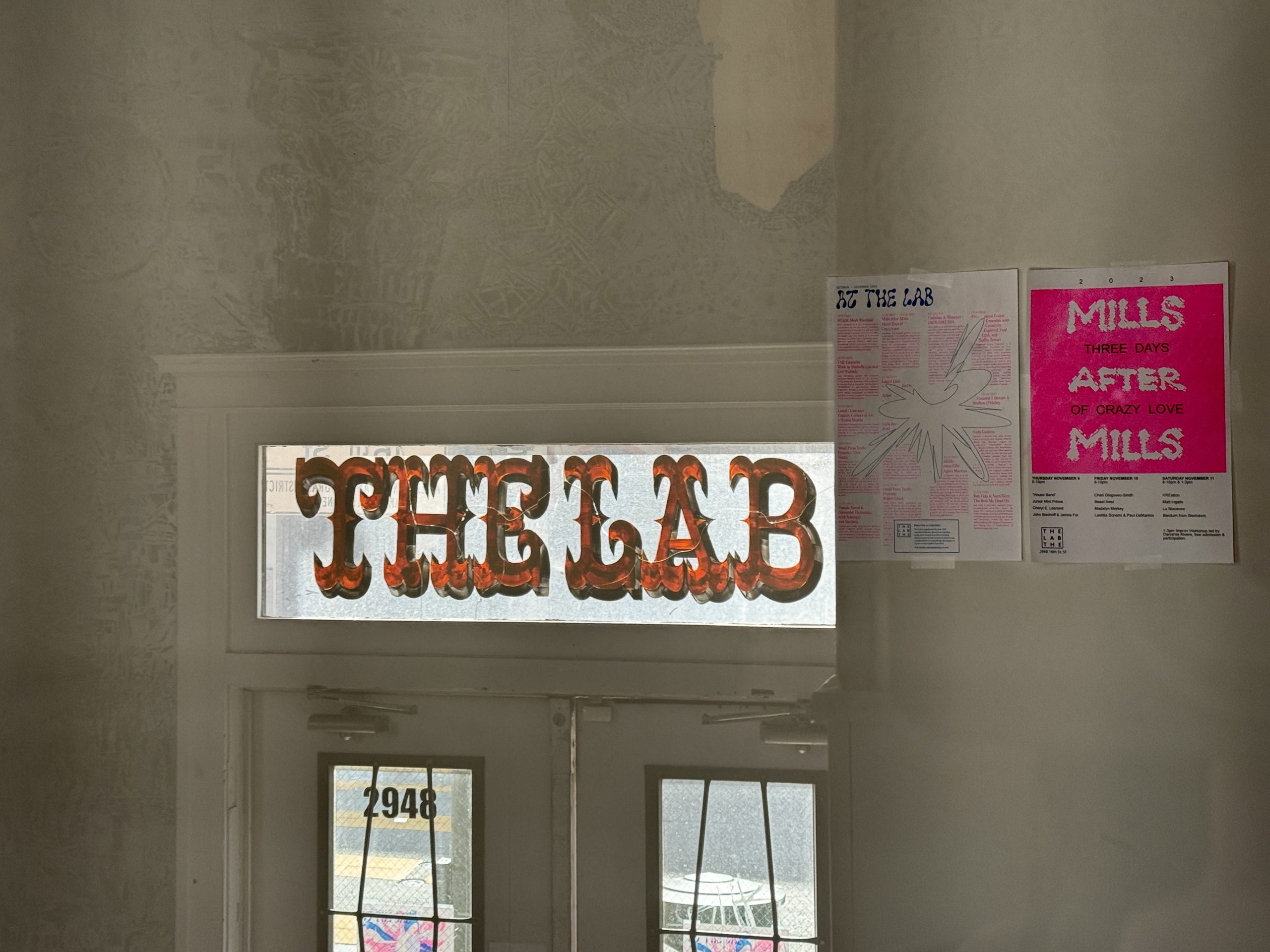 A doorway with a sign that says the lab.