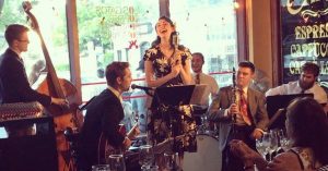 A group of people playing music in a restaurant.