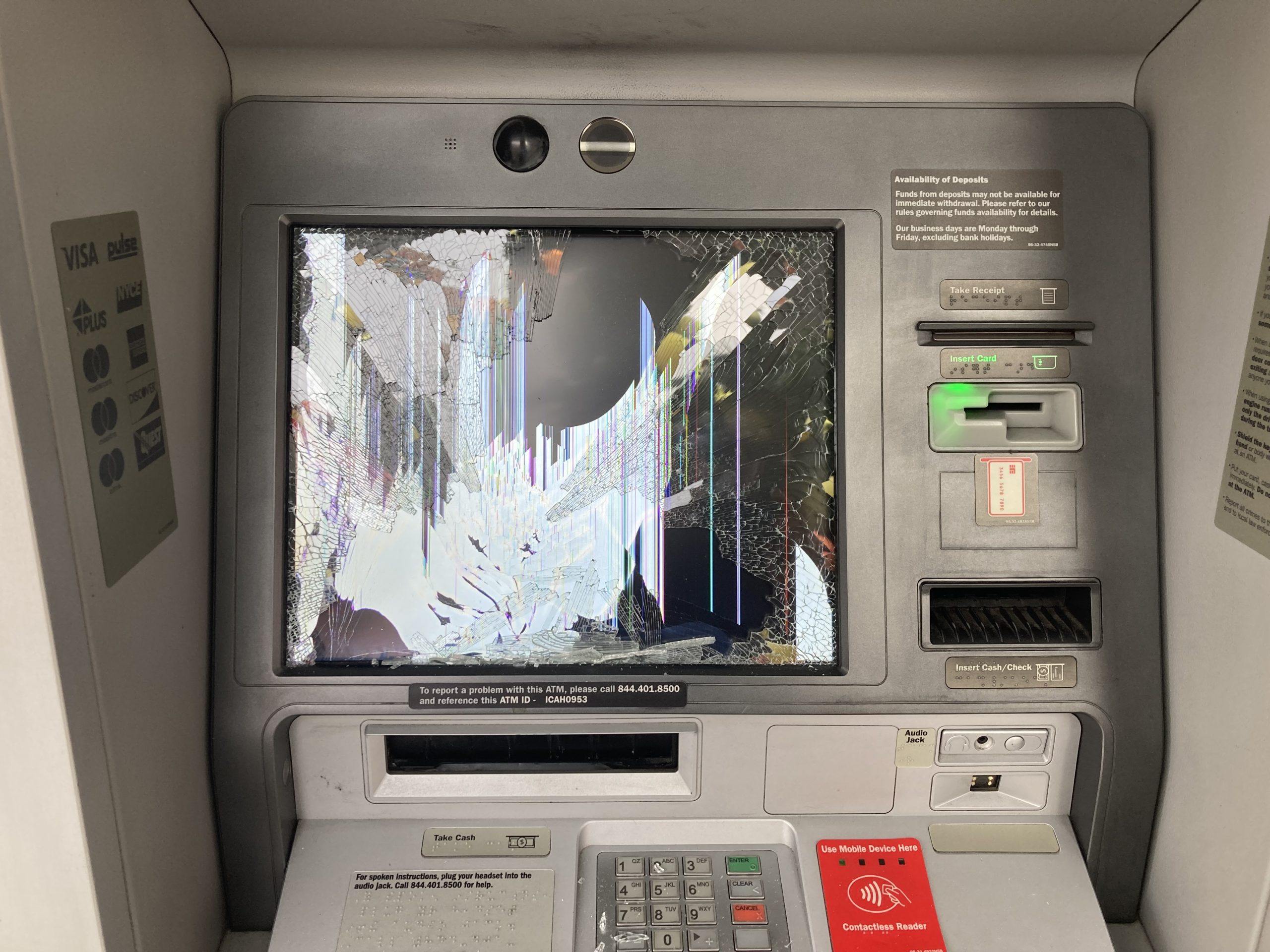 An ATM with a broken screen