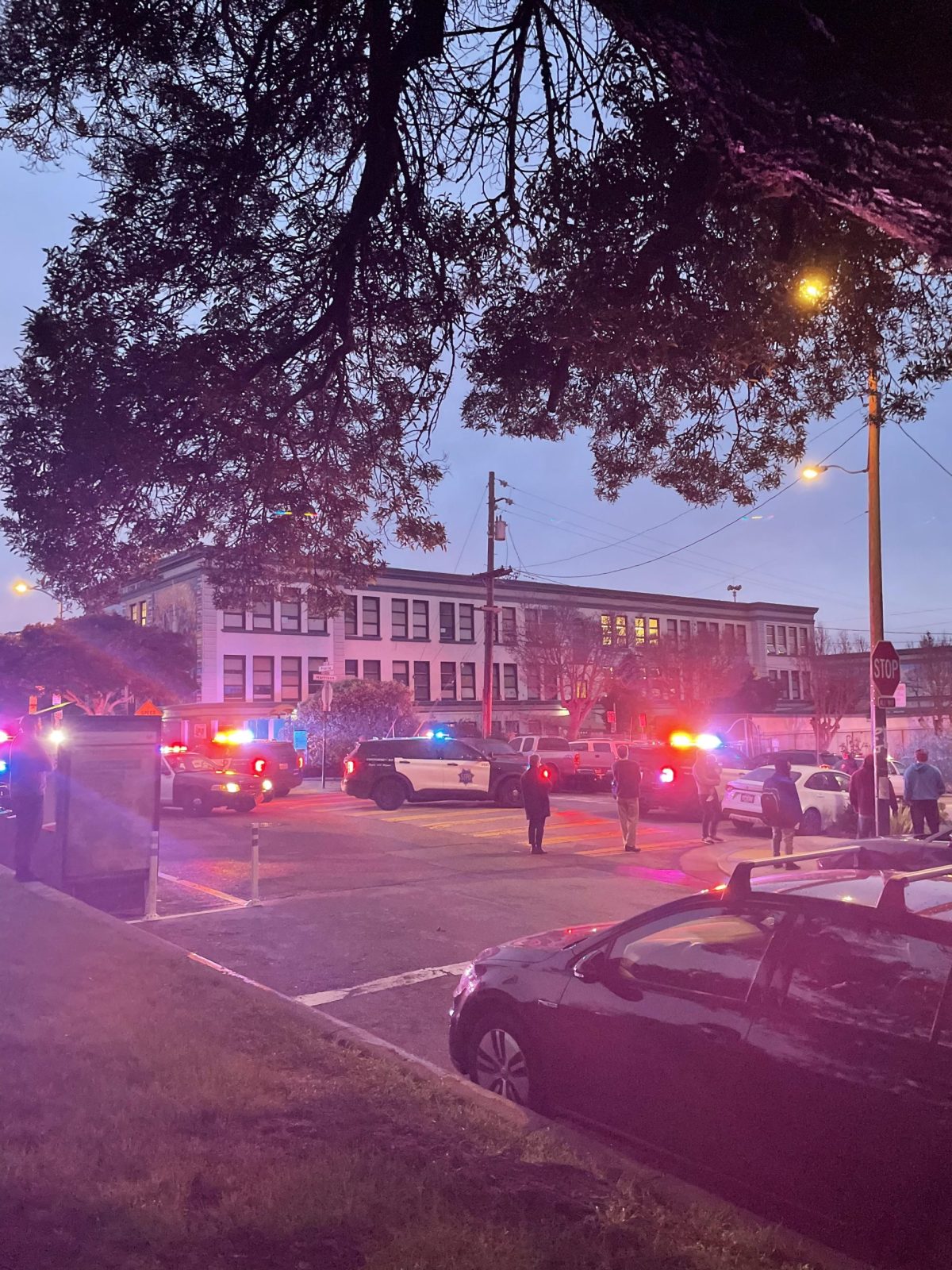 A police car is parked in front of a building.