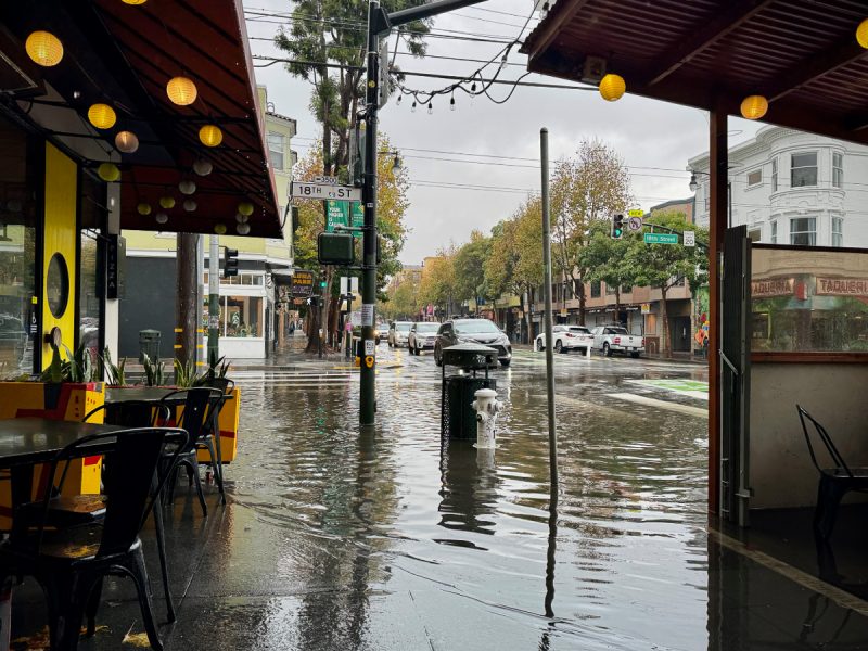 A waterlogged street corner at Valencia and 18th streets.
