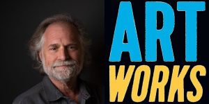 A man with a beard and a black background with the words art works.