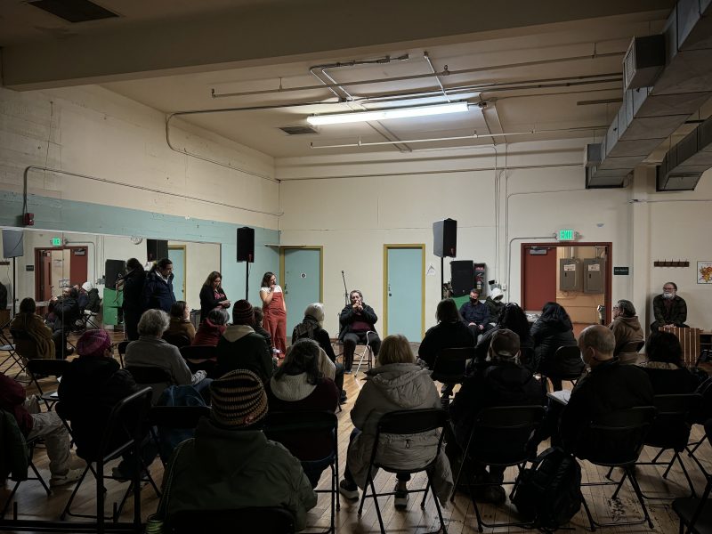 A group of people sitting in chairs in a room