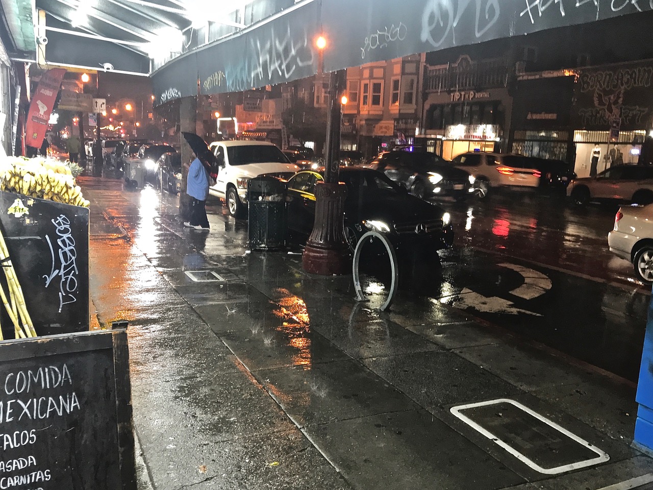 The sidewalk is wet.