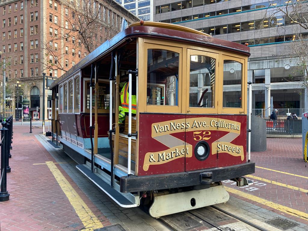 A red cable car on California Street in San Francisco.