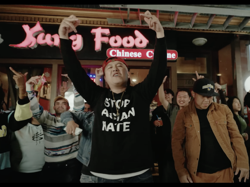 A group of people, including Chino Yang, standing in front of a restaurant.