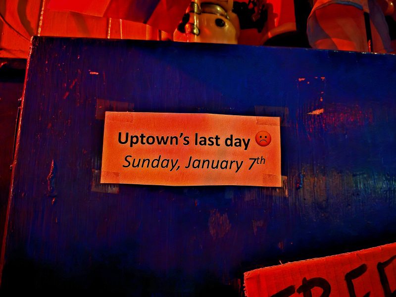 A sign that says "Uptown's last day Sunday January 7th."