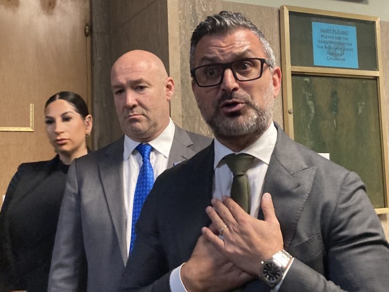 Attorneys for Nima Momeni, outside a courtroom. Momeni is accused of killing Bob Lee.