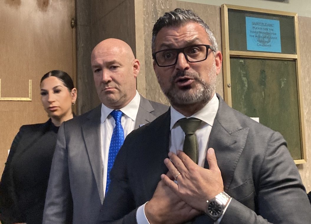 Attorneys for Nima Momeni, outside a courtroom. Momeni is accused of killing Bob Lee.