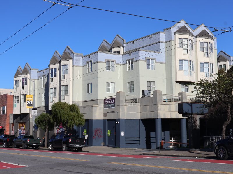 An apartment building on a street in san francisco.