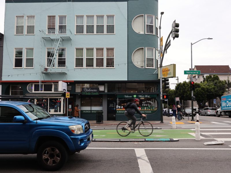 A person riding a bicycle on a street.