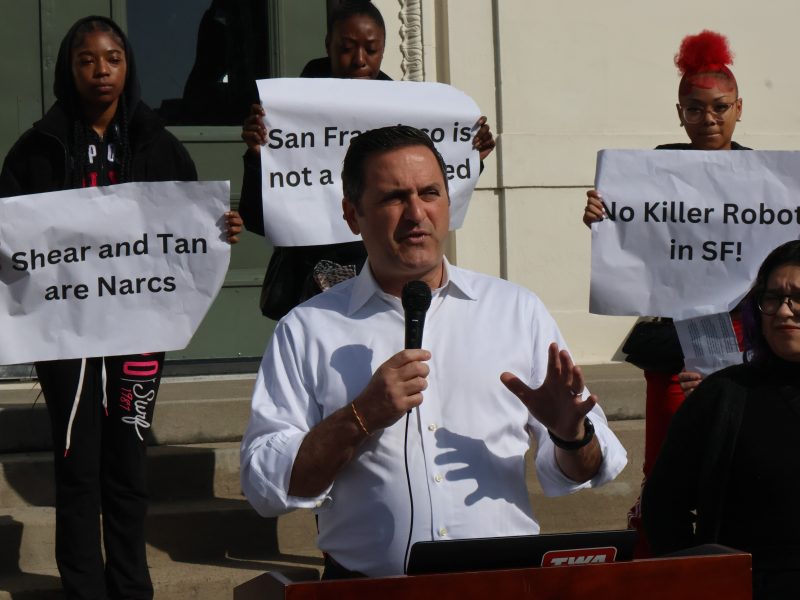 A demonstration against Proposition E outside Y Combinator's offices