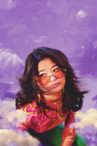 Woman with sunglasses making a whimsical expression against a purple cloudy backdrop.