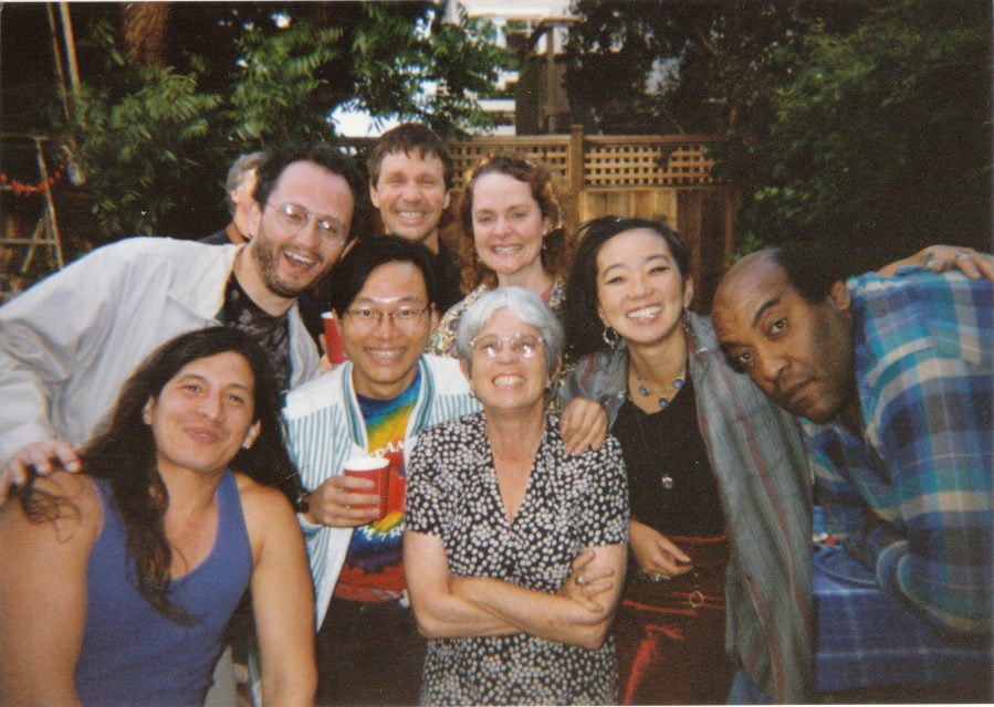 Joan holden in the center with glasses on.