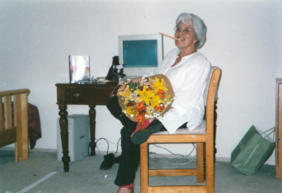 Joan Holden holding flowers. "She was ruled with passion. Her complexity is something we knew and understood," said Holden's daughter, Kate Chumley. Photo courtesy of the Holden-Chumley family.