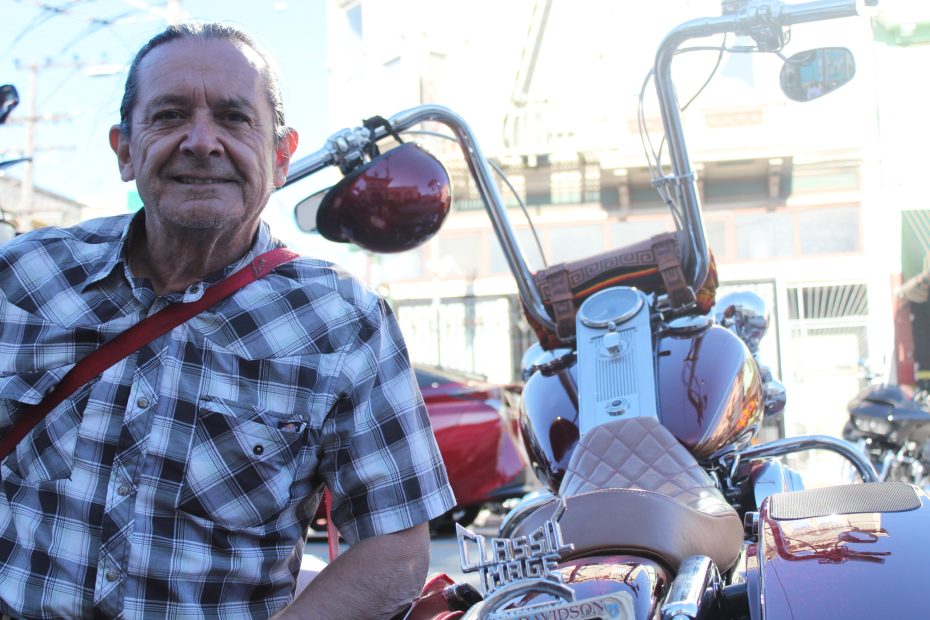 Carlos Gonzales poses next to the cap he made for his friend. Gonzales said he's been making them for 10 years for his homies only o