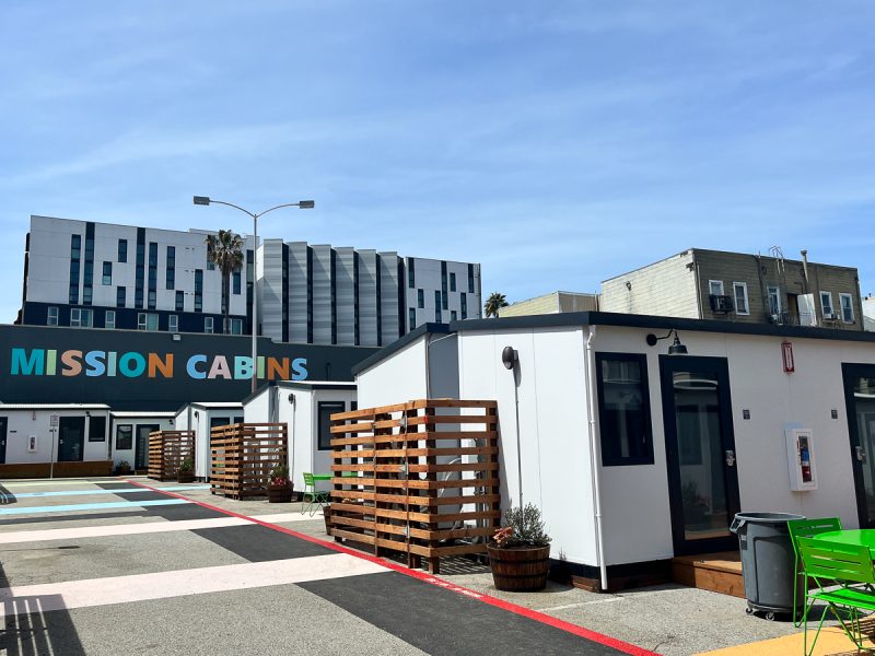 A small housing complex labeled "mission cabins," featuring small, white cabins.