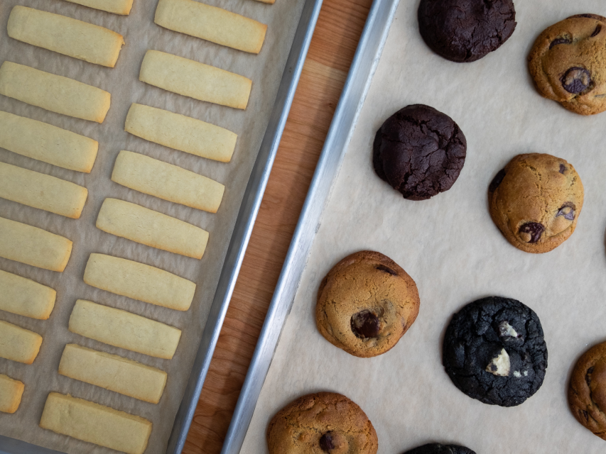 cookies and shortbread in two bake sheets