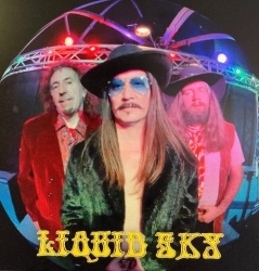 Album cover of liquid sky featuring three band members in colorful attire standing under a lighted stage structure, with the band name at the bottom.