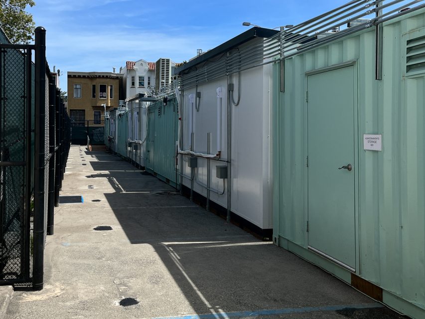 A row of green storage containers.