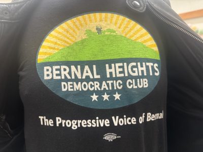 Buck Bagot poses for a photo with his Bernal Heights Democratic Club t-shirt. Jackie Fielder came one vote short of securing the club's endorsement at the club's vote on Thursday May 16, 2024. Photo by Oscar Palma.