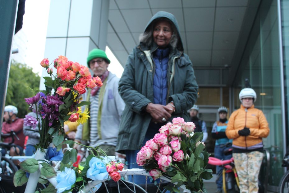 Gashaw Clark's mother looks at her son's ghost bike at the intersection of Mission Bay Blvd. and 3rd Street on Wednesday May 15, 2024. Photo by Oscar Palma.
