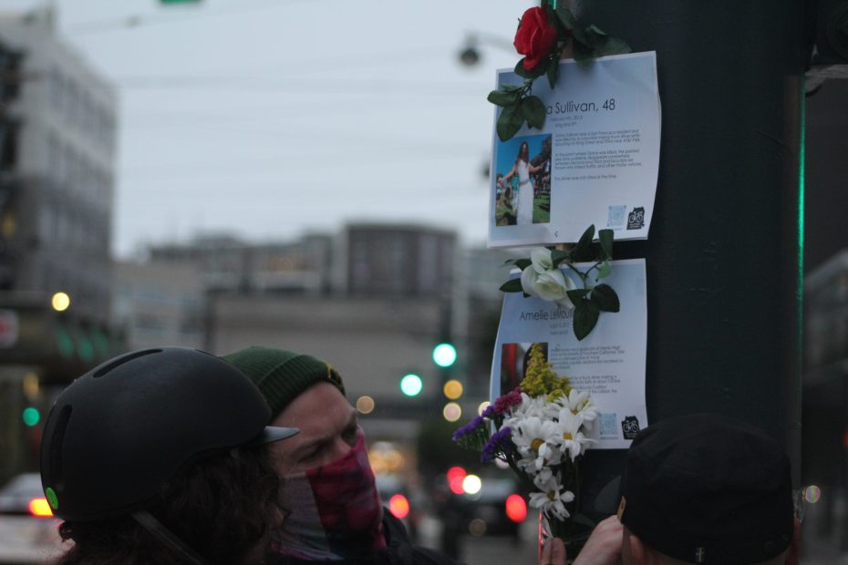 Tyler Dixson places two memorial posters at the intersection of 4th and King streets during the Ride of Silence on Wednesday May 15, 2024. Photo by Oscar Palma.