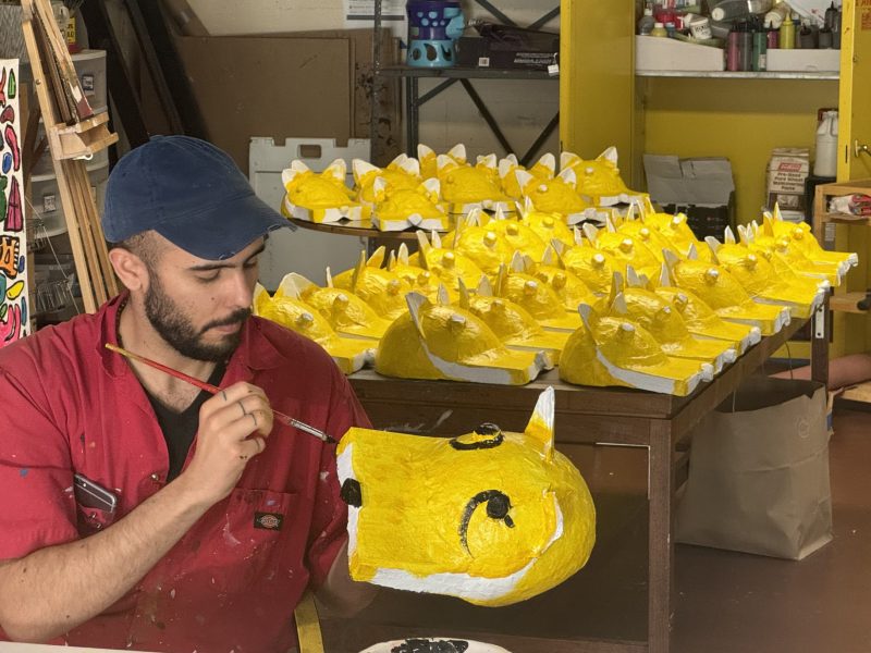 Daniel Iturralde painting the jaguar head-pieces that will be used in this Sunday's parade at Carnaval on Wednesday May 22, 2024. Photo by Oscar Palma.