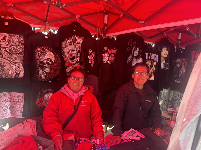 street vendors pose for a picture next to their stand at La Placita on Tuesday May 7, 2024. Photo by Oscar Palma