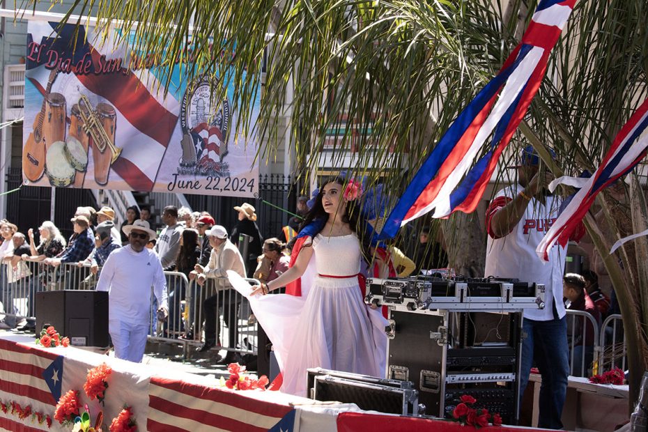 Puerto rican float with lots of people.