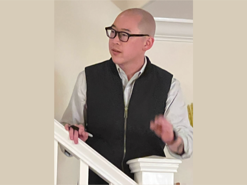 Jay Cheng, speaking on a staircase