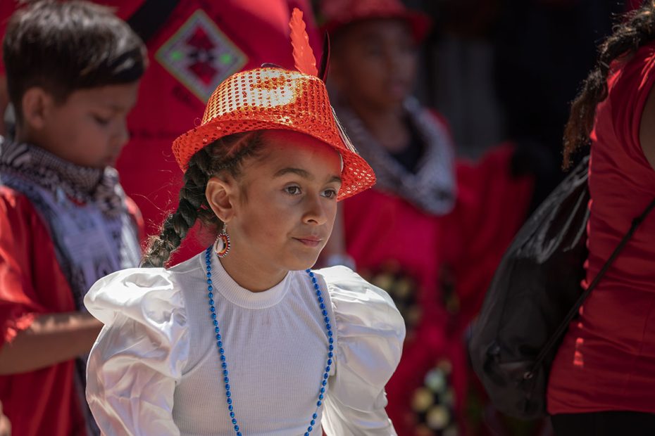 A young girl with a red hat in sf carnaval