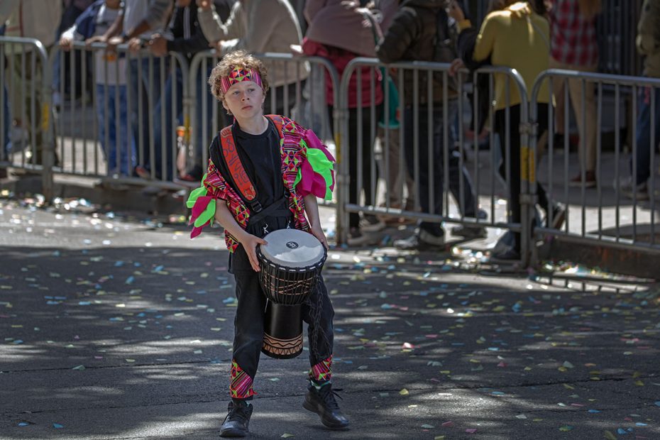 A lone drummer in a parade.